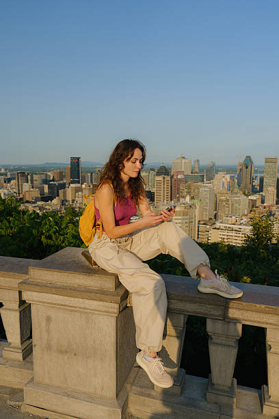 istock Woman using smartphone in Montreal, Canada 2211510056