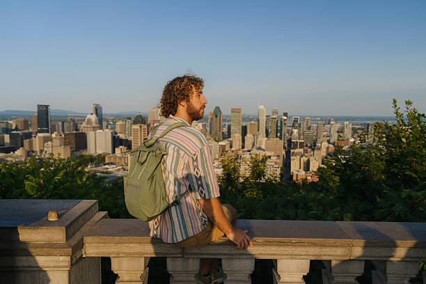 istock Man looking at Montreal cityscape from Mount Royal 2211510064