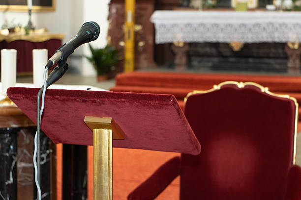 An open bible on a pulpit in an empty church.Similar images: