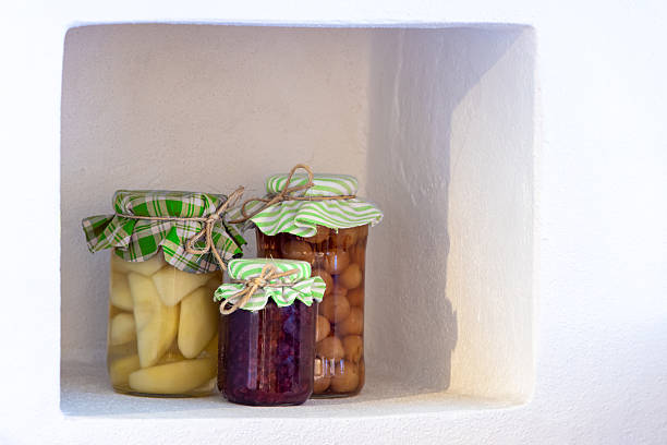 Fruit compotes in traditional jars with a textile lid