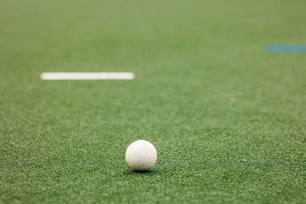 istock Field hockey ball on artificial turf pitch 2211510543