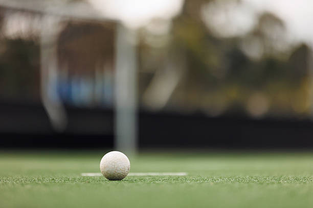 Field hockey ball on artificial turf pitch