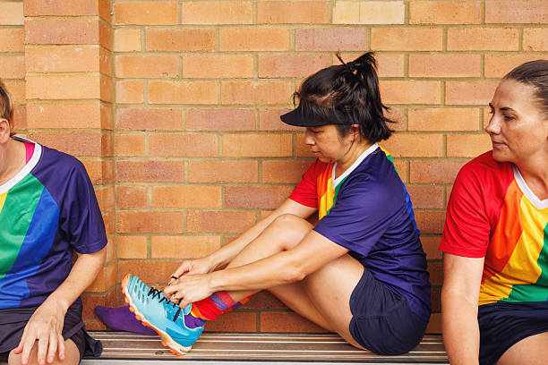 istock LGTBQIA field hockey team members getting ready before a match 2211510562