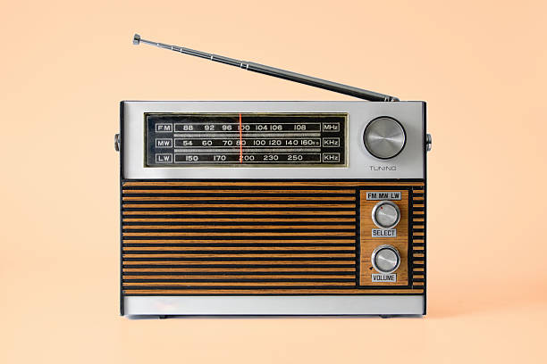 istock Authentic 70s radio receiver. Front view. Isolated on light peach background 2211512174