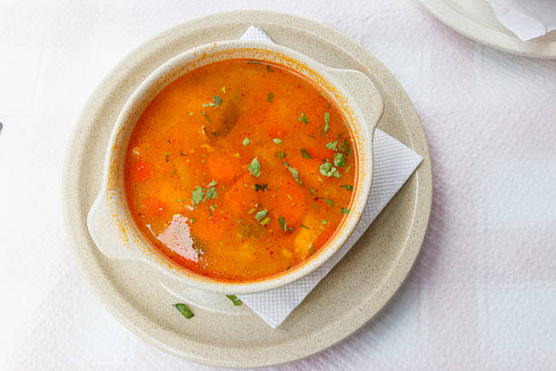 Fish soup on a table in a restaurant. Top view