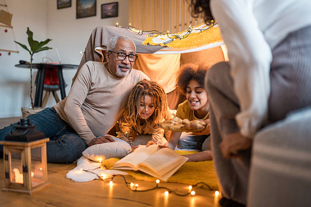 istock Diverse Family Reading Together Indoors 2211519309