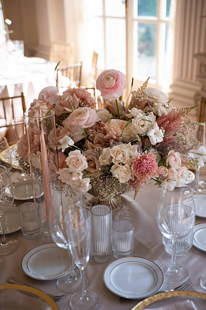 istock Romantic blush floral centerpiece on formal dinner table 2211520610