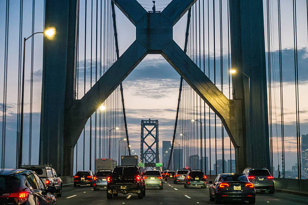 istock Traffic flows under the Oakland Bay Bridge at sunset 2211520944