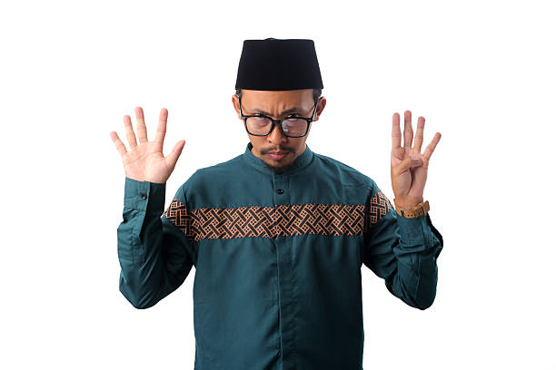 istock Angry Asian Muslim Man Showing Number Nine Gesture 2211526147