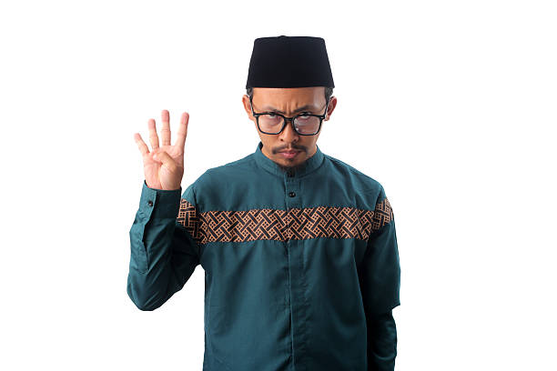istock Angry Asian Muslim Man Showing Number Four Gesture 2211526154