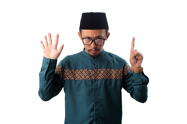 istock Angry Asian Muslim Man Showing Number Six Gesture 2211526155