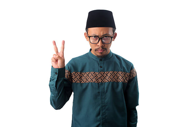 istock Angry Asian Muslim Man Showing Number Two Gesture 2211526160