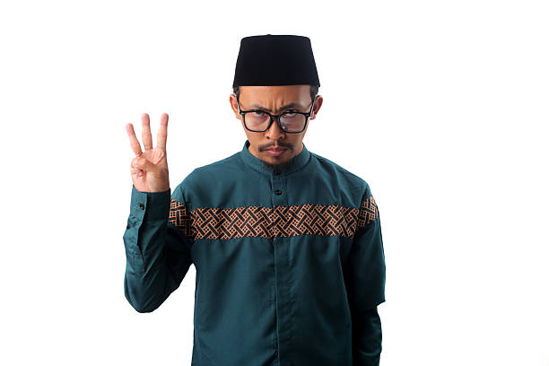 istock Angry Asian Muslim Man Showing Number Three Gesture 2211526186