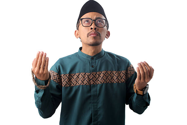 istock Asian Muslim Man Praying with Open Hands in Prayer Gesture 2211526575