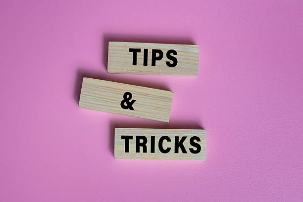 istock tips and tricks words on wooden blocks isolated on pink background 2211526597