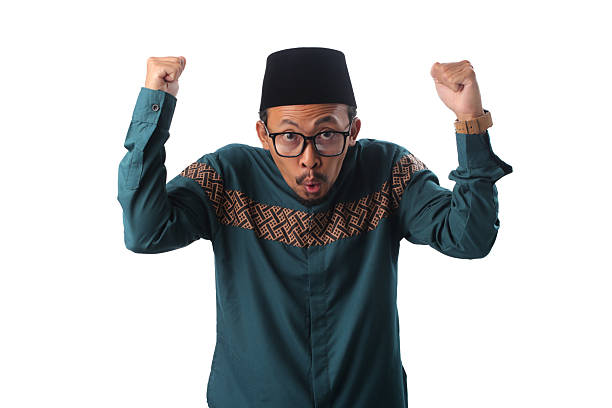 istock Surprised Asian Muslim Man Celebrating Victory on Eid al-Fitr 2211527592
