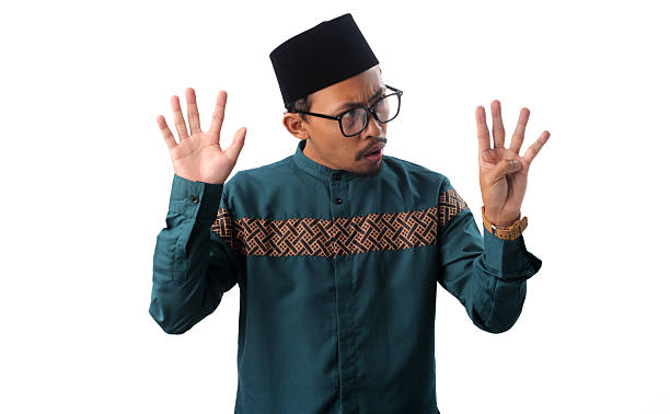 istock Surprised Asian Muslim Man Showing Number Nine Gesture 2211527678