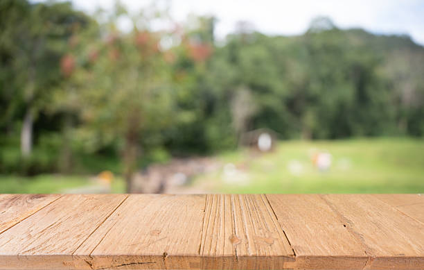 istock Empty wood table top and blur of restaurant background selective focus product display 2211528676