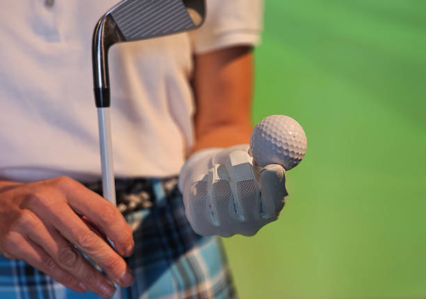 Golfer hitting the ball in a  golf course