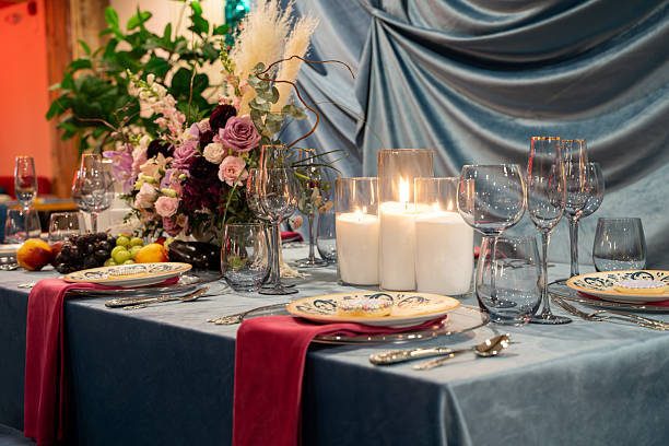 istock View of empty plates and empty glasses on a luxury dining table. 2211529940