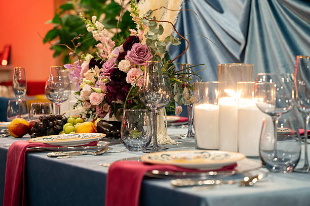istock View of empty plates and empty glasses on a luxury dining table. 2211529984
