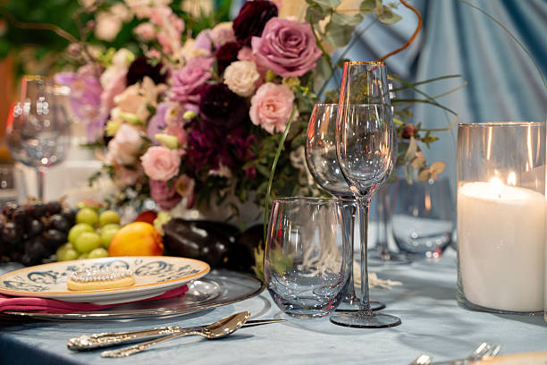 istock View of empty plates and empty glasses on a luxury dining table. 2211530038