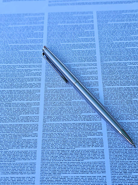istock Collection of text documents with a pen resting on the paper highlighting the importance of written communication concept 2211530933
