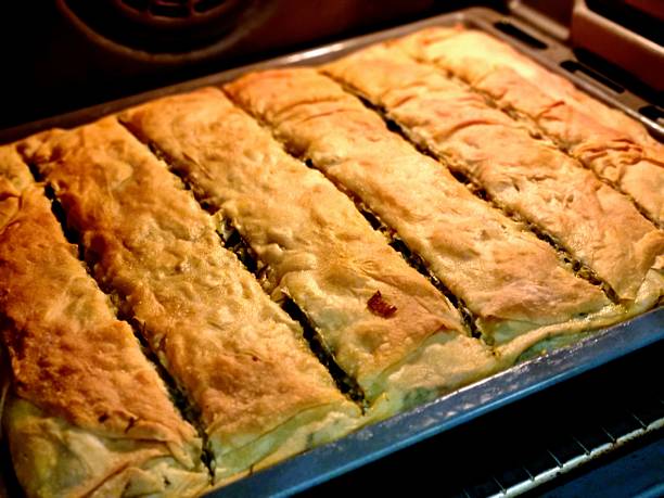 istock Golden Greek Pie Baking in Oven 2211531938