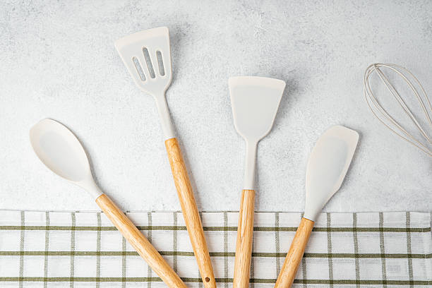 istock Kitchen utensils arranged on a checkered towel for culinary tasks 2211532338