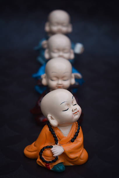Four cute little buddhist monks
