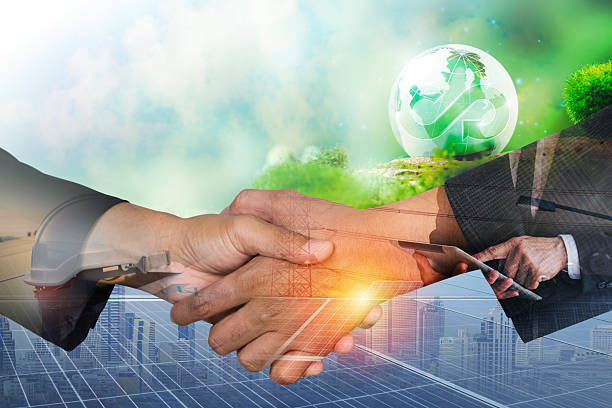 istock Two people having a shaking hands against solar panel after the conclusion of the agreement 2211537230