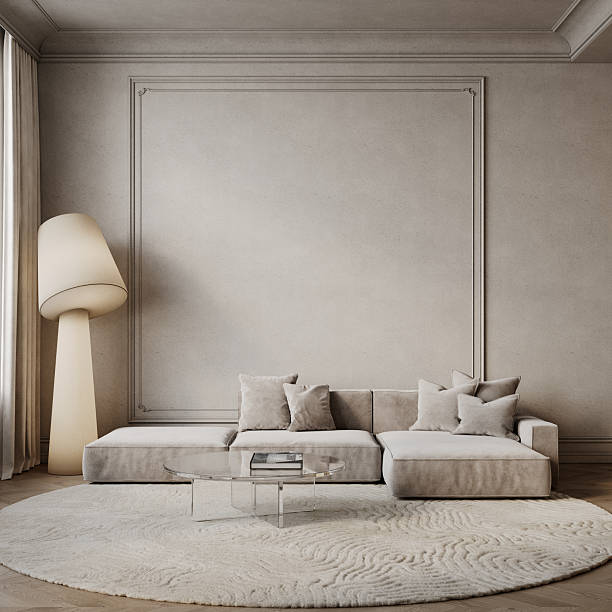 istock Classic beige interior with sofa, floor lamp, coffee table, round carpet, moldings and decor. 3d render illustration mockup. 2211539951