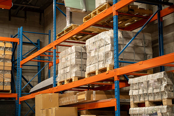 istock Goods stacked on pallets in a warehouse. 2211540460