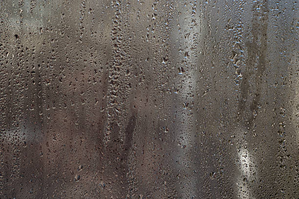 istock water drops on wet glass. background. 2211540583
