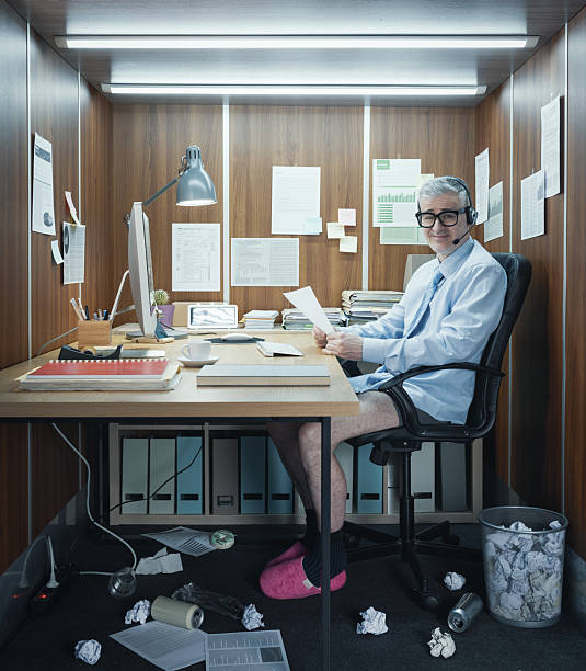 istock Funny businessman working in his office without pants 2211541890