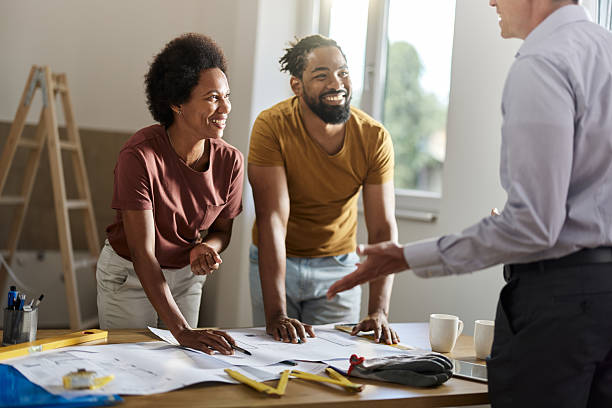 istock Happy black couple talking to an architect during home renovation process. 2211542183