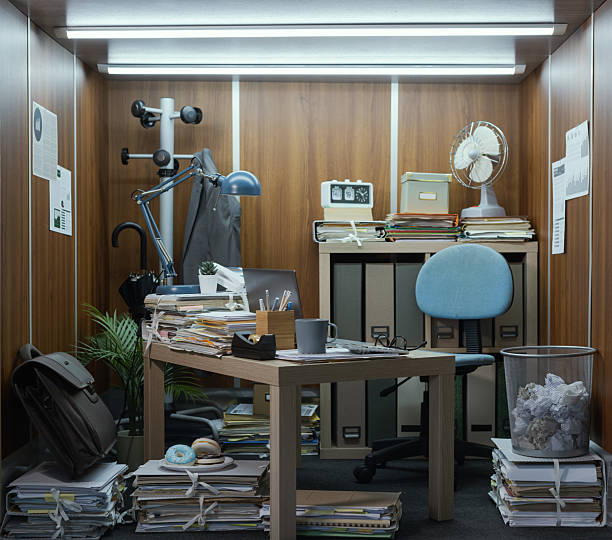 istock Tiny office interior with desk and lots of paperwork 2211543272