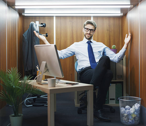 istock Portrait of a businessman in a tiny office 2211544323