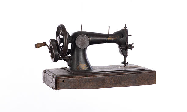 istock black ancient sewing retro machine isolated on white background 2211545625