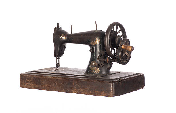 istock black ancient sewing retro machine isolated on white background 2211545627