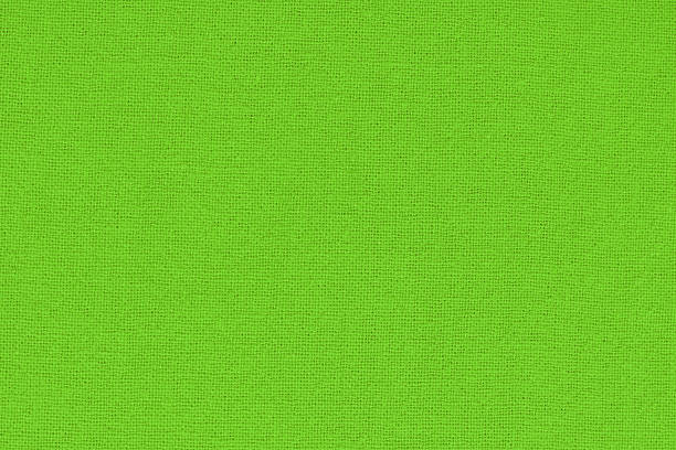 istock Light green cotton fabric cloth texture for background, natural textile pattern. 2211546635
