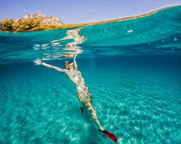 istock Beautiful woman diving underwater 2211548778