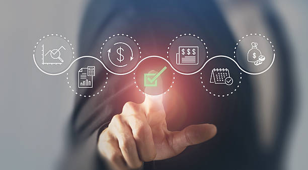 istock Digital financial approval concept. Business professional interacts with a virtual interface illustrating financial processes, with a green checkmark symbolizing successful approval and completion. 2211548871