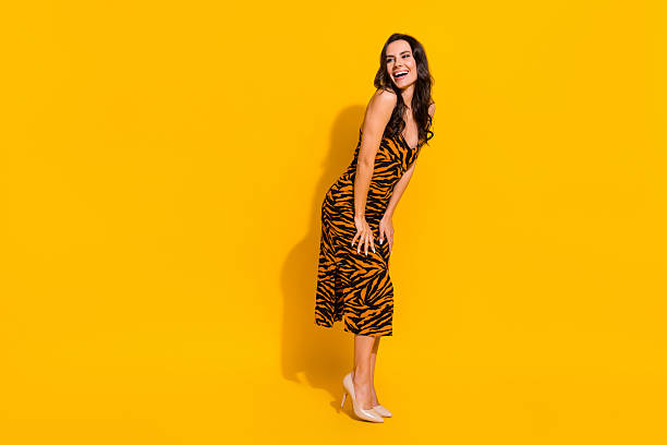istock Full size profile side photo of young cheerful lady look empty space curious isolated over yellow color background 2211551345