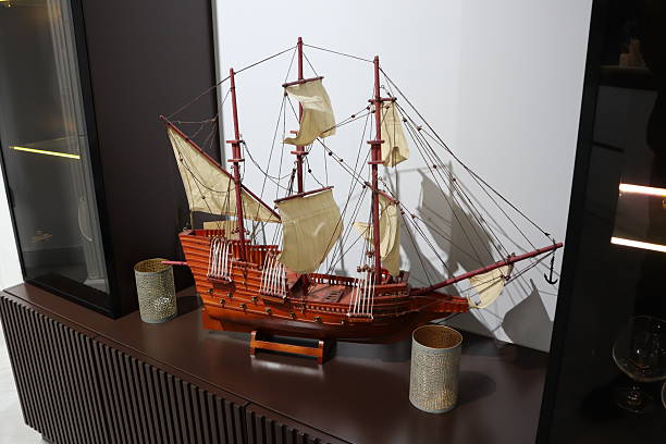A detailed model ship with exquisite sails is showcased in a stylish decor, creating a picturesque ambiance