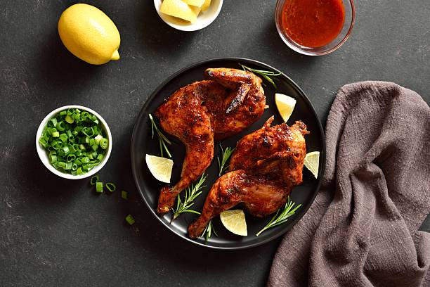 istock Roasted half chicken with lemon and rosemary 2211556653