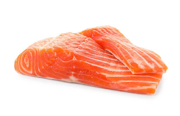 istock Pieces of fresh salmon isolated on white 2211560348