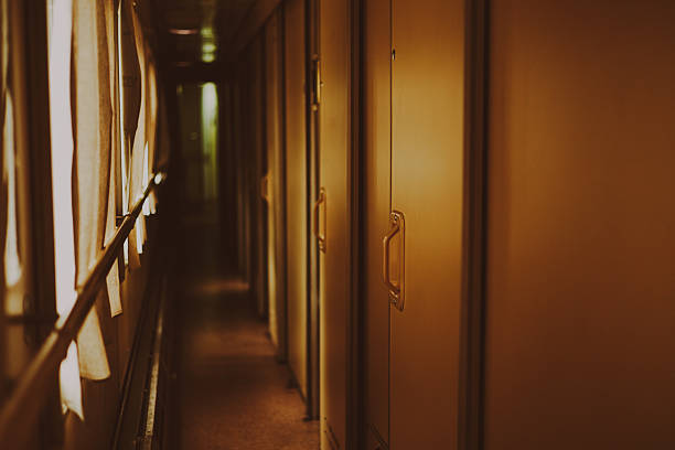 istock Passenger train corridor door with windows 2211564484