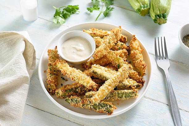 istock Crispy zucchini fries with dipping sauce 2211564659