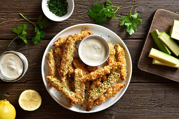 istock Crunchy zucchini breaded sticks with dip sauce 2211564672